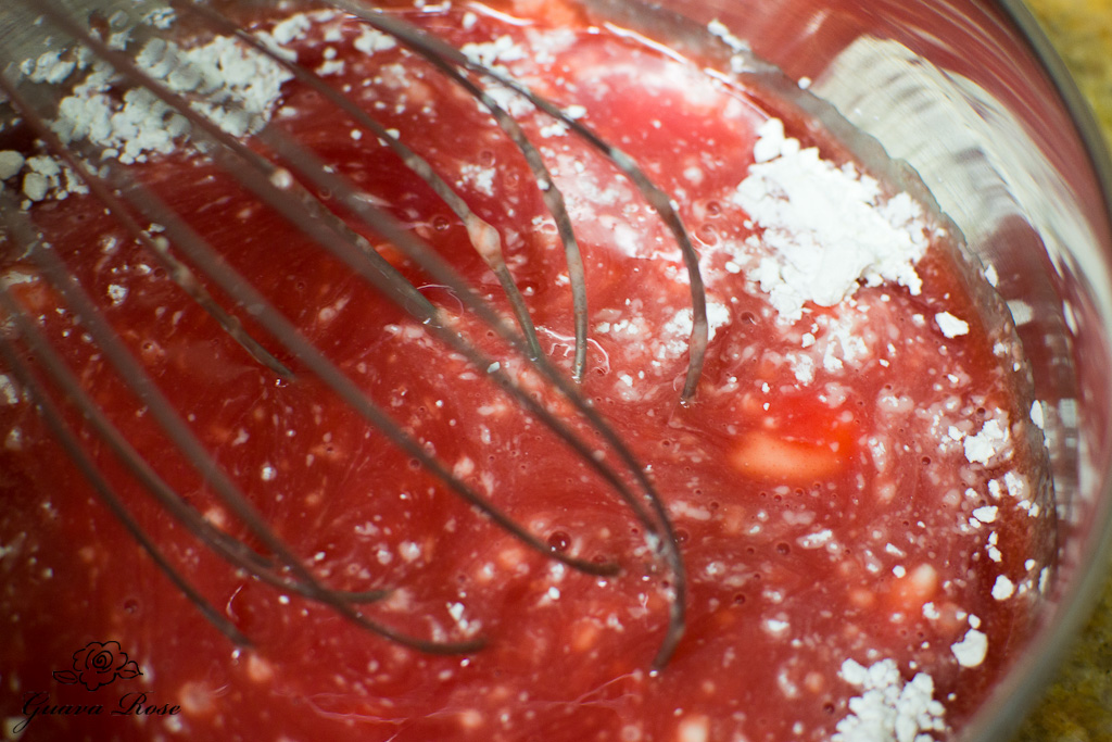 Whisking cornstarch into guava juice concentrate
