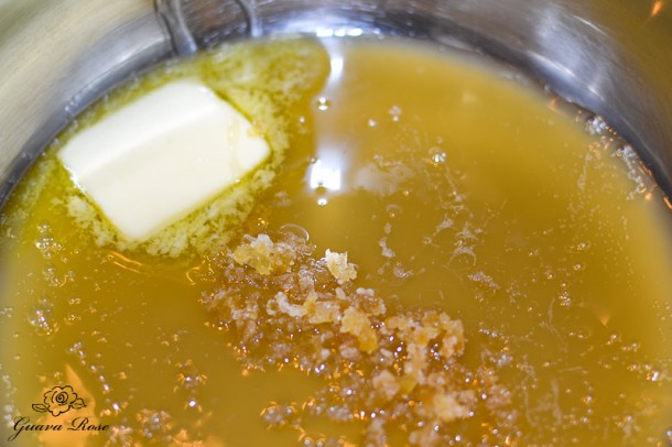 Brown rice syrup, butter, candied ginger in pot