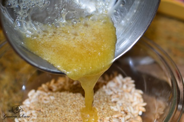 Pouring brown rice syrup over puffed rice