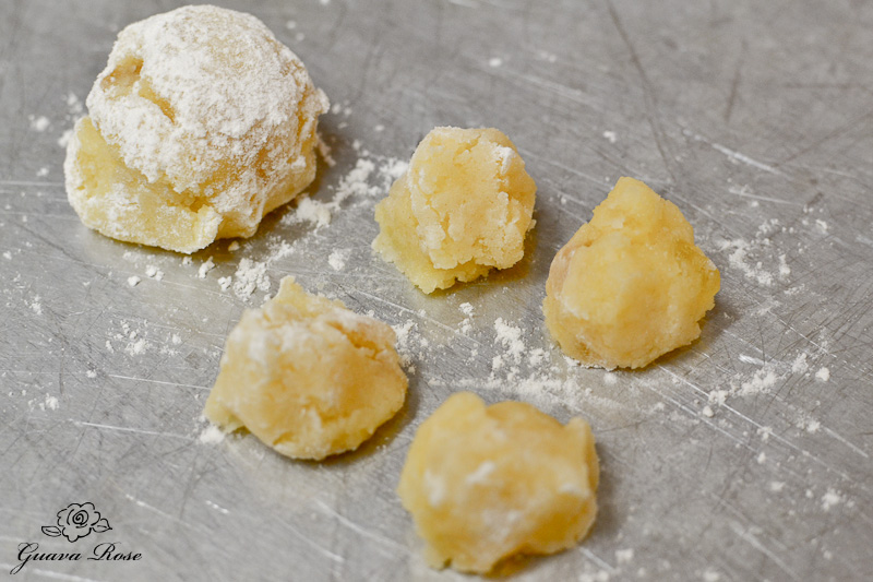 coconut pineapple macaroon scoop of dough, and scoop divided into four mini cookies