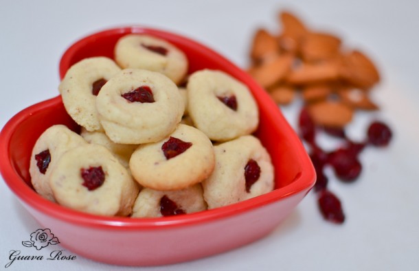 Cherry almond cookie bites in red heart bowl