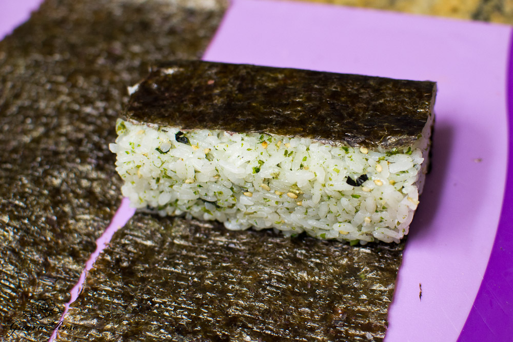 Folding nori over rice