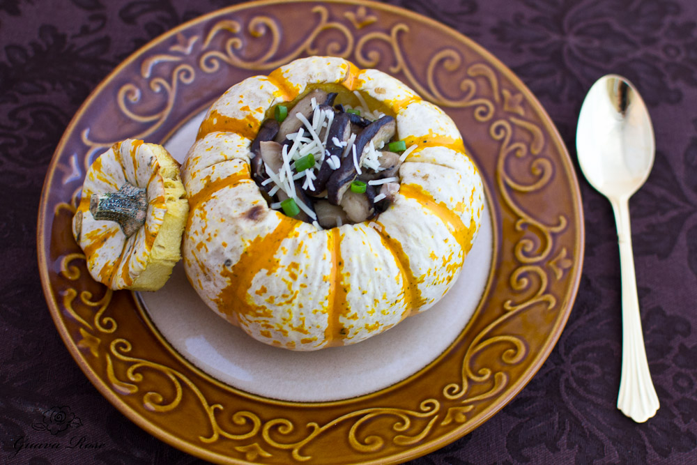 Tiger mini pumpkin filled with pearl couscous and sauteed mushrooms, top