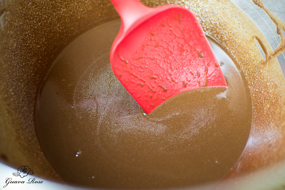 Mixing cocoa+hot water with butter and oil