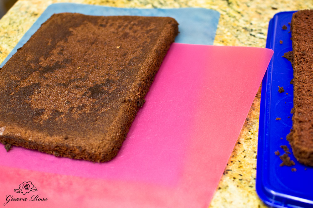 Placing top cake layer on mat