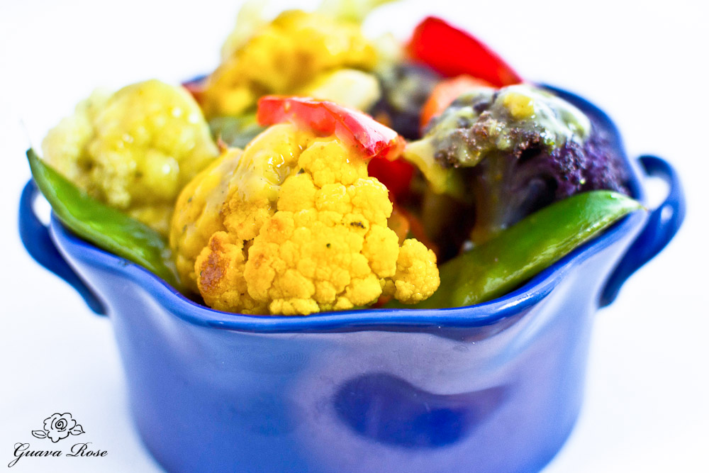 Bowl of Roasted Vegetables with Coconut Curry Sauce, side view