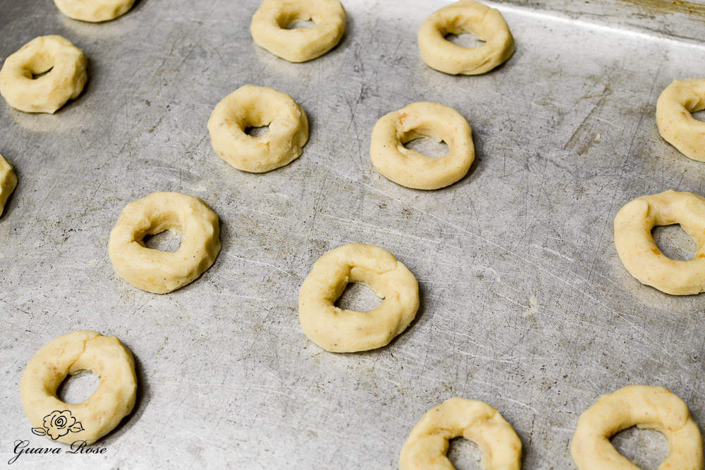 Mini donut cookie dough on baking sheet