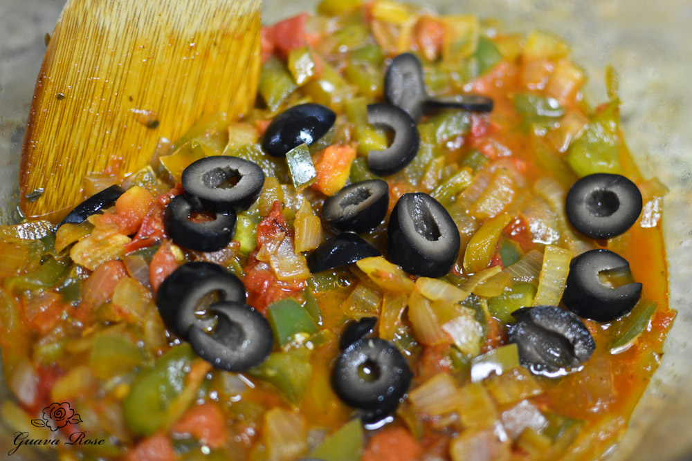 Sauteed onions, bell peppers, with tomatoes and olives