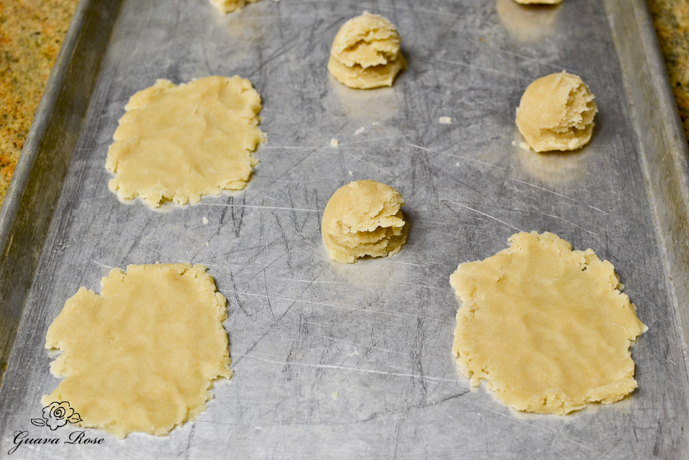 Pressing manju dough onto pan