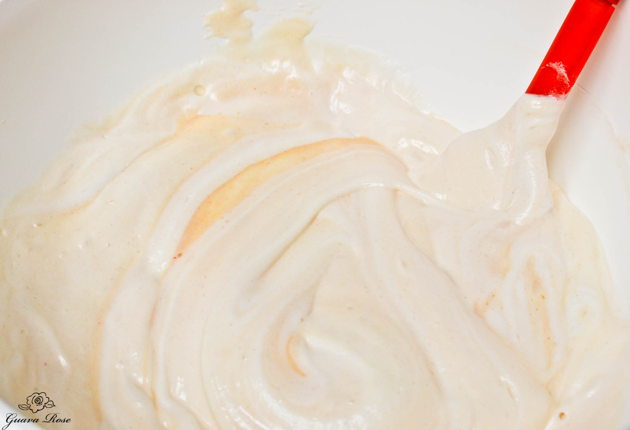 Continuing to fold meringue into batter