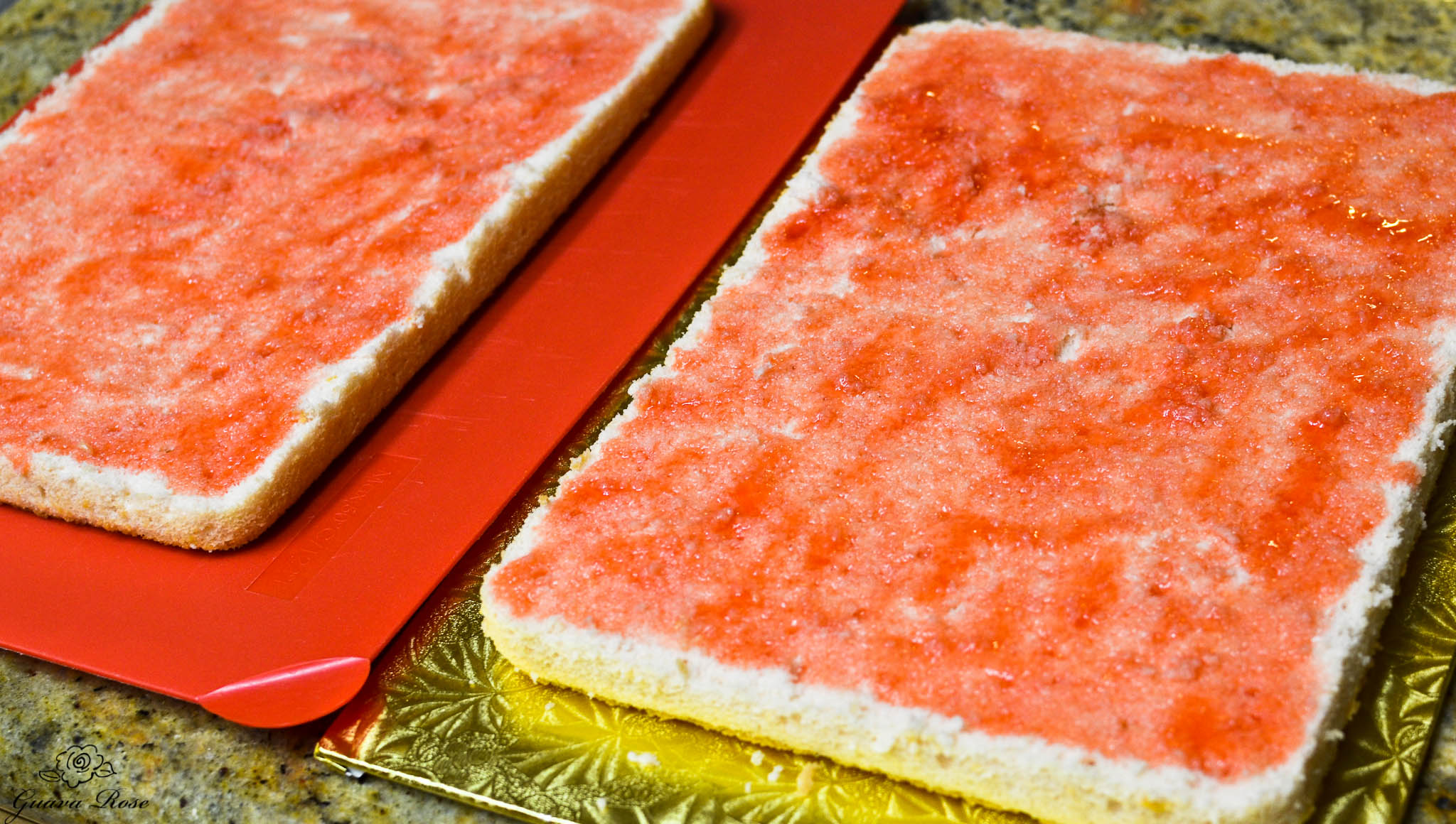 Guava syrup brushed on cake layers