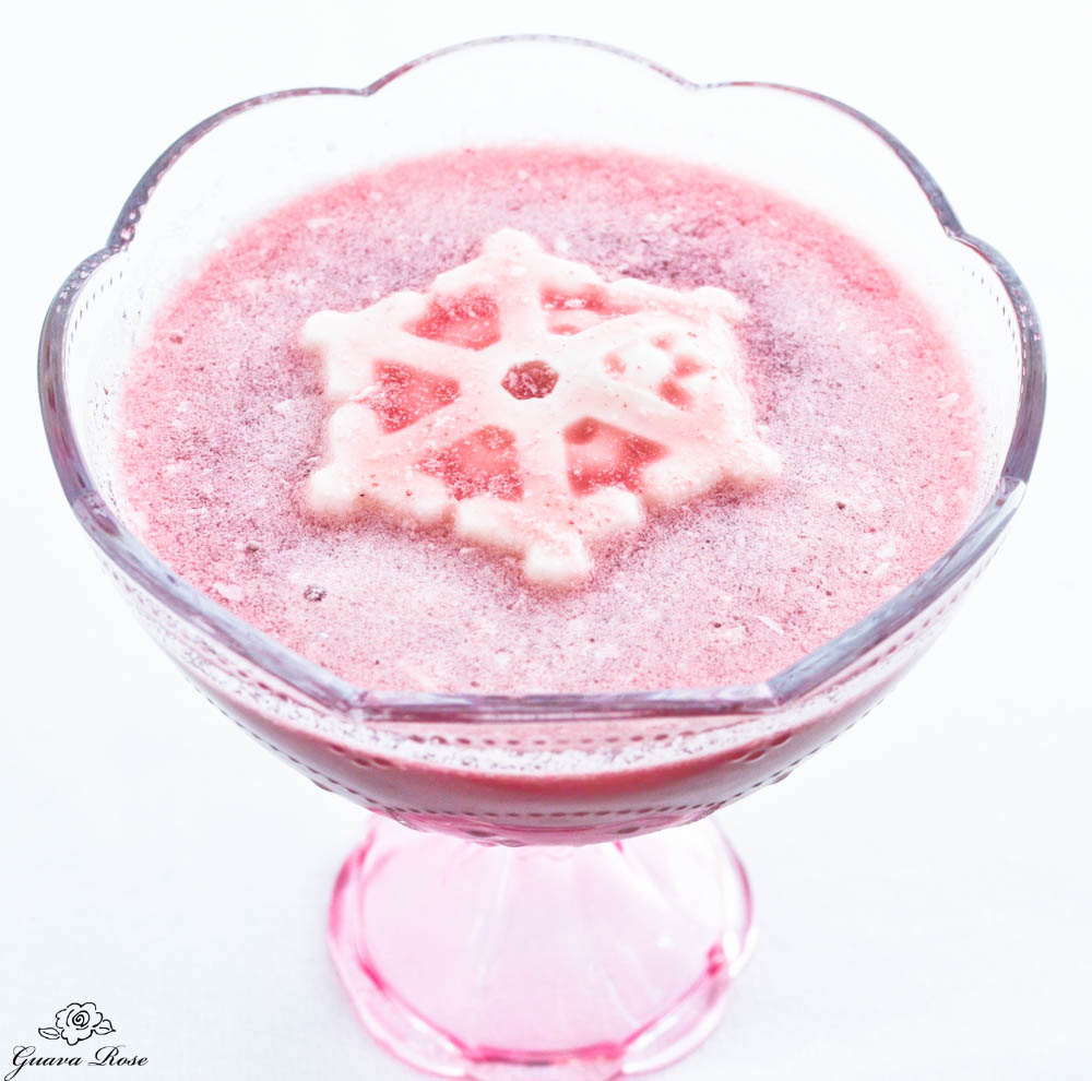 Individual serving of probiotic punch with coconut milk snowflake