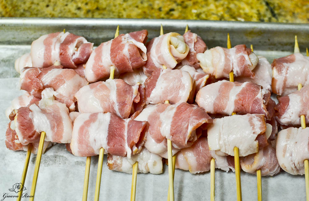 Tray of uncooked bacon wrapped mochi