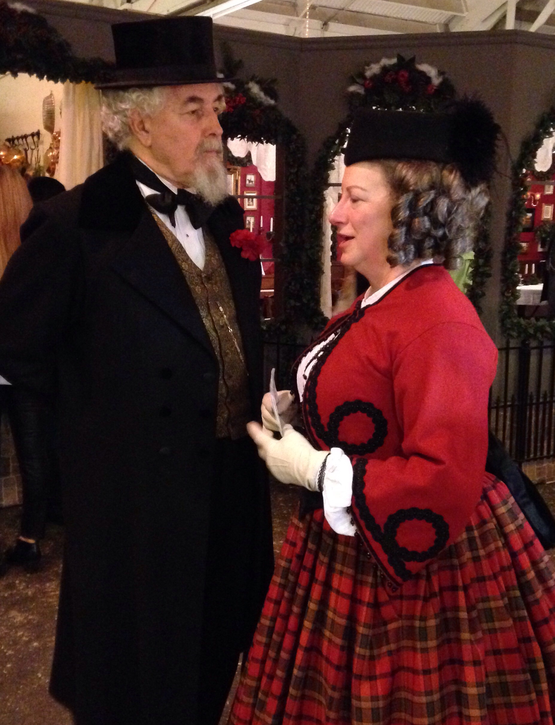 Charles Dickens conversing with a woman