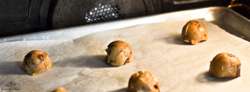Chewy chocolate chip cookie dough on parchment